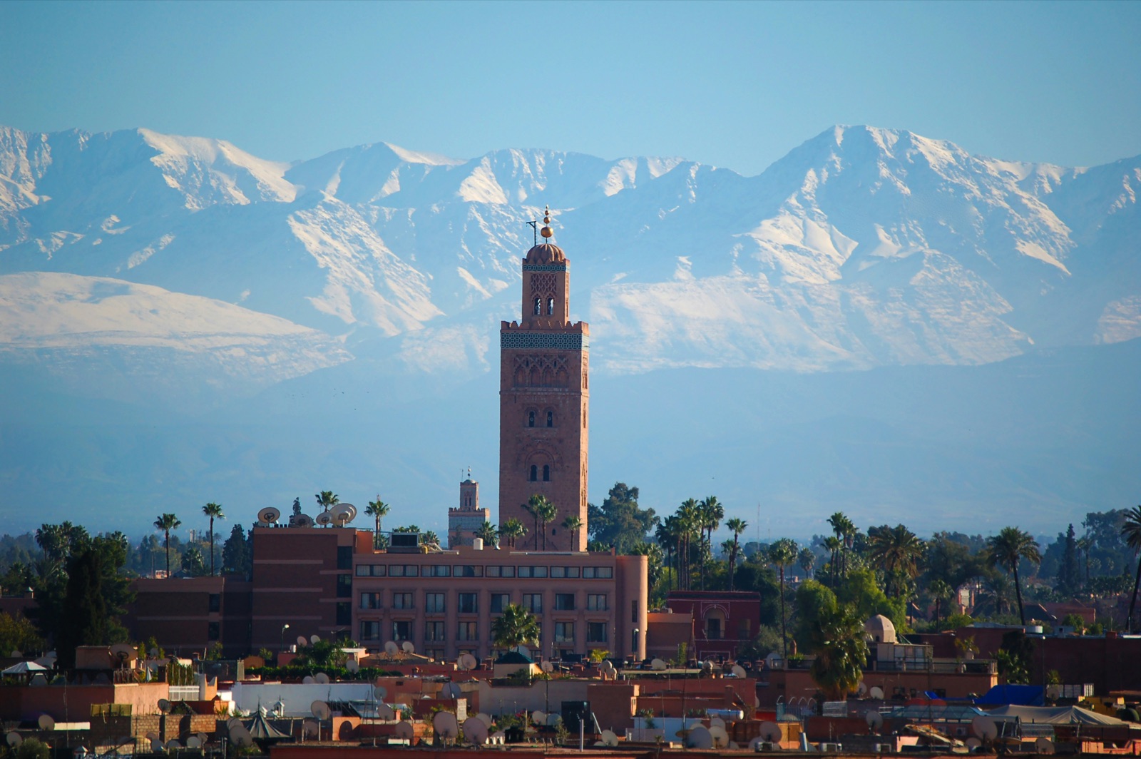 Jemaa el-Fnaa square and the Koutoubia Mosque at dusk, Marrakech, Morocco